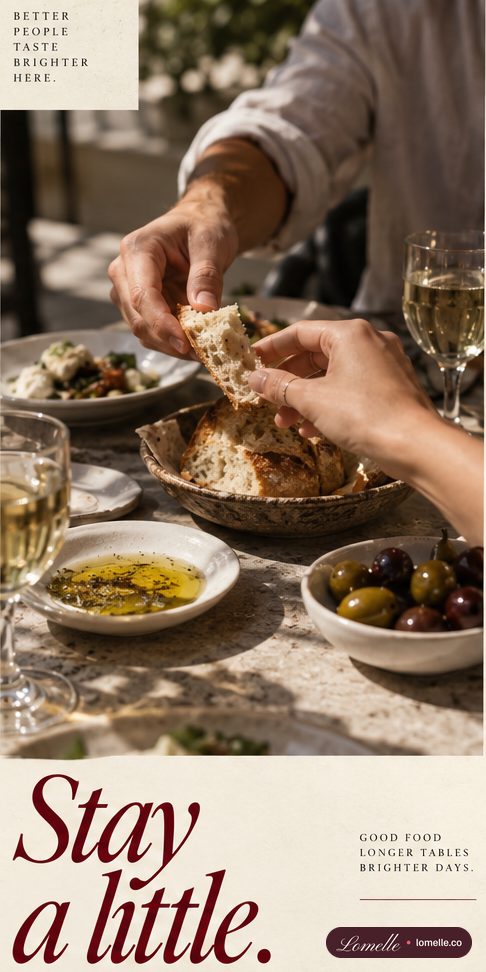 Story frame of hands sharing bread over olives and oil, “Stay a little.”